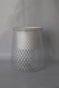 Clear plastic self-watering planter with water reservoir for easy care