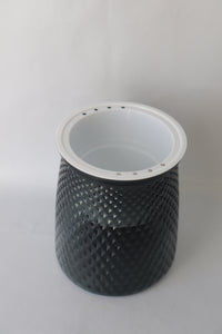 Grey plastic self-watering planter with water reservoir for easy care