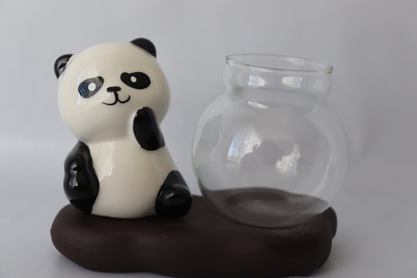 Sitting Panda propargation station with a small prop bowl