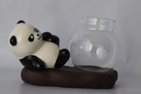 Laying Panda figurine with a proporgation bowl for plant cutting
